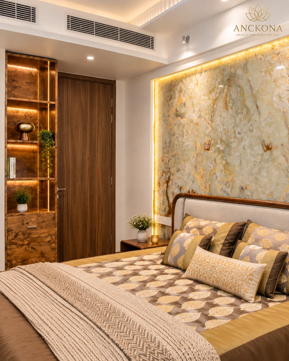 Master bedroom with upholstered bed and illuminated feature wall